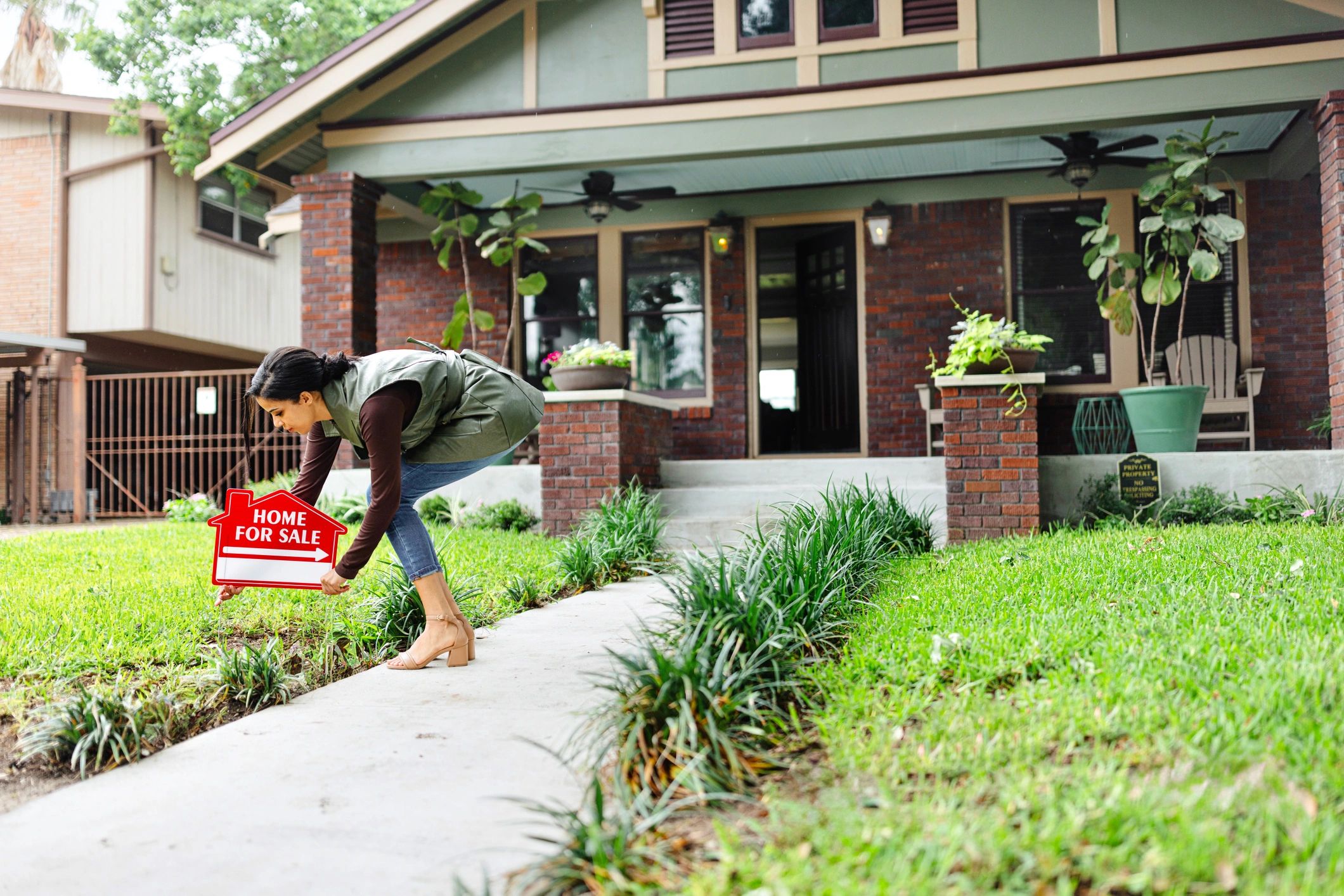 real estate agent installing sign
